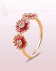 Three pink daisy rings