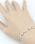 925 Sterling Silver Dolphin Bracelet on a woman's hand