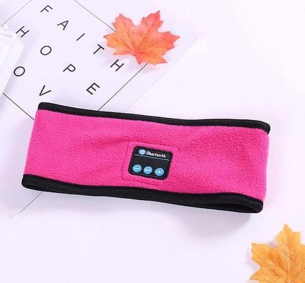 Pink Outdoor Fitness Yoga Wireless Bluetooth Headband Over a photo frame