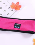 Pink Outdoor Fitness Yoga Wireless Bluetooth Headband Over a photo frame