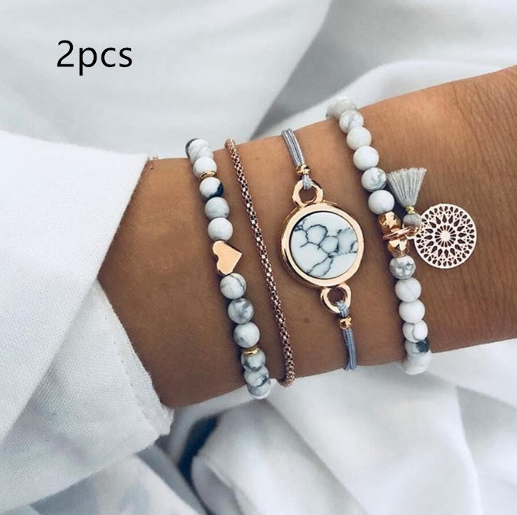 4 Pcs Bohemian Love Turquoise Bracelet in man&#39;s hand