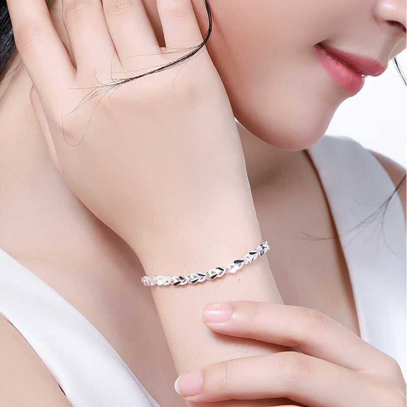 Girl wearing Sterling Silver XO Bracelet