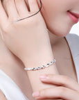 Girl wearing Sterling Silver XO Bracelet