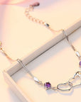 Amethyst Love Links Bracelet on a table