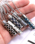 Five Cylinder Pendant Necklaces in woman's hand