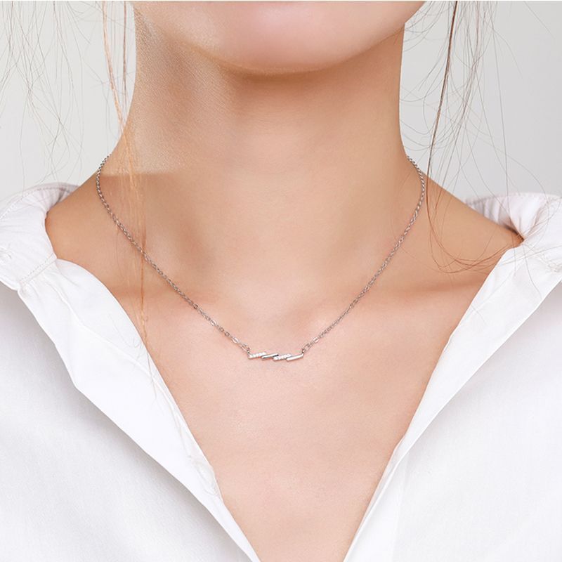 White dressed girl wearing S925 Sterling Silver Wave Pendant Necklace