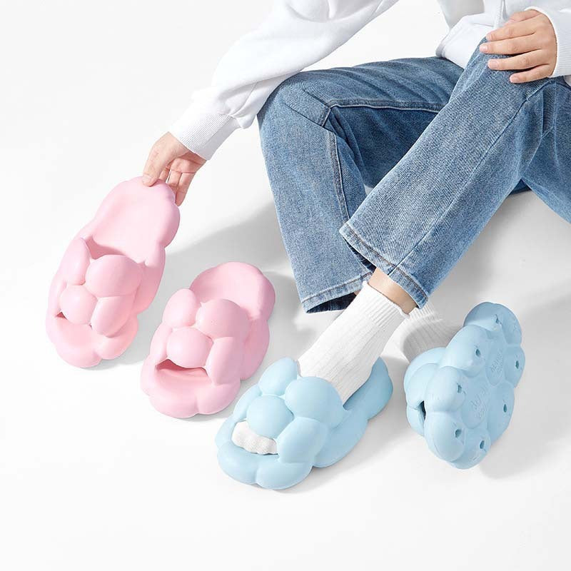 Girl wearing blue colored and holding pink colored Soft Cloud Design Cute House Slippers for Women