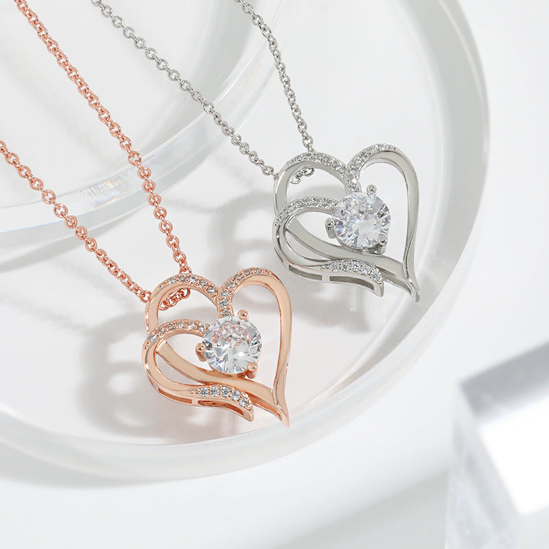 Zircon Double Love Necklace over a table