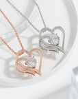 Zircon Double Love Necklace over a table