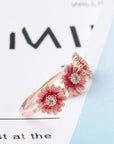 Three pink daisy rings