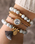 4 Pcs Bohemian Love Turquoise Bracelet in woman's hand