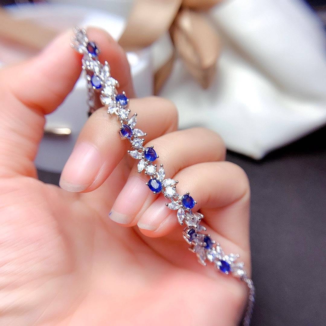 925 Sterling Silver Sapphire Bracelet in finger a lady