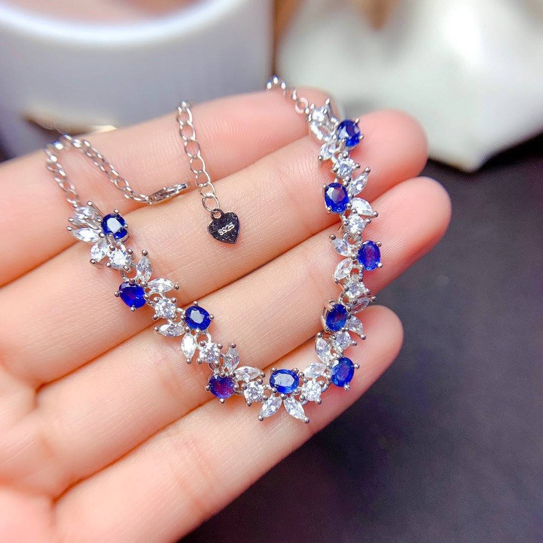 925 Sterling Silver Sapphire Bracelet in woman's palm