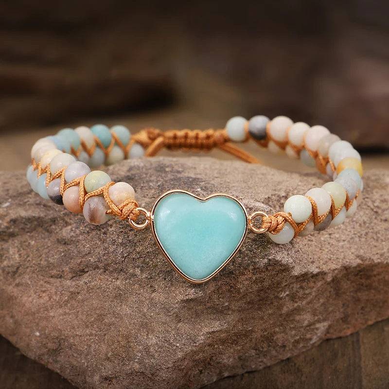 Amazonite String Braided Heart Bracelet over a rock