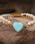 Amazonite String Braided Heart Bracelet over a rock