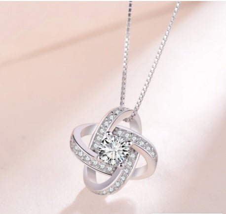 925 Sterling Silver Forever Heart Necklace in off white background