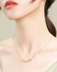 Girl wearing gold colored Magnetic Folding Heart Shaped Four Leaf Clover Necklace