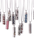 Twelve Cylinder Pendant Necklaces hanging image