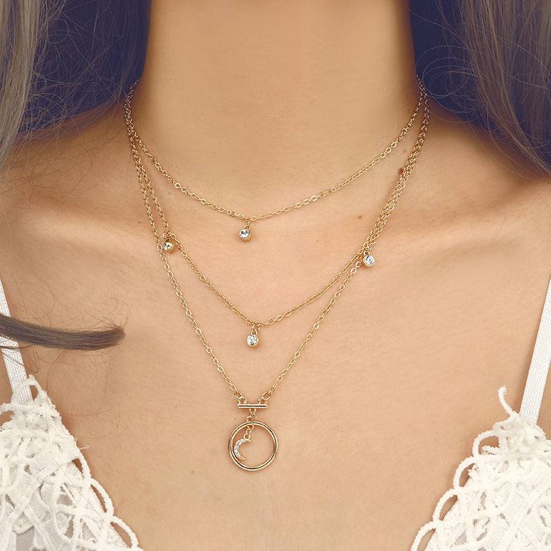 White dressed girl wearing Antique Gold Circle Moon Bohemian Necklace