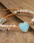 Amazonite String Braided Heart Bracelet over a table