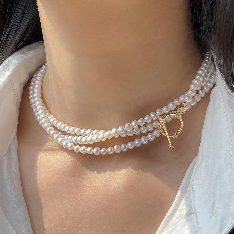 White dressed woman wearing Natural Freshwater Long Pearl Necklace