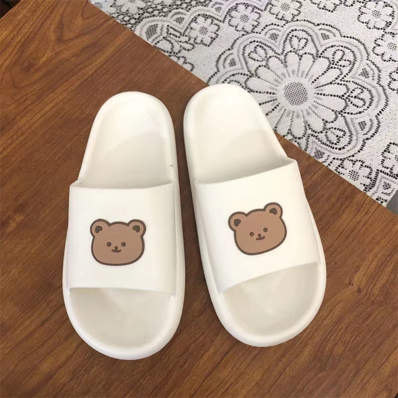 White colored Cute Bear Slippers Summer Beach Shoes over a table