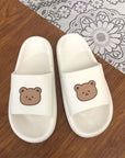 White colored Cute Bear Slippers Summer Beach Shoes over a table