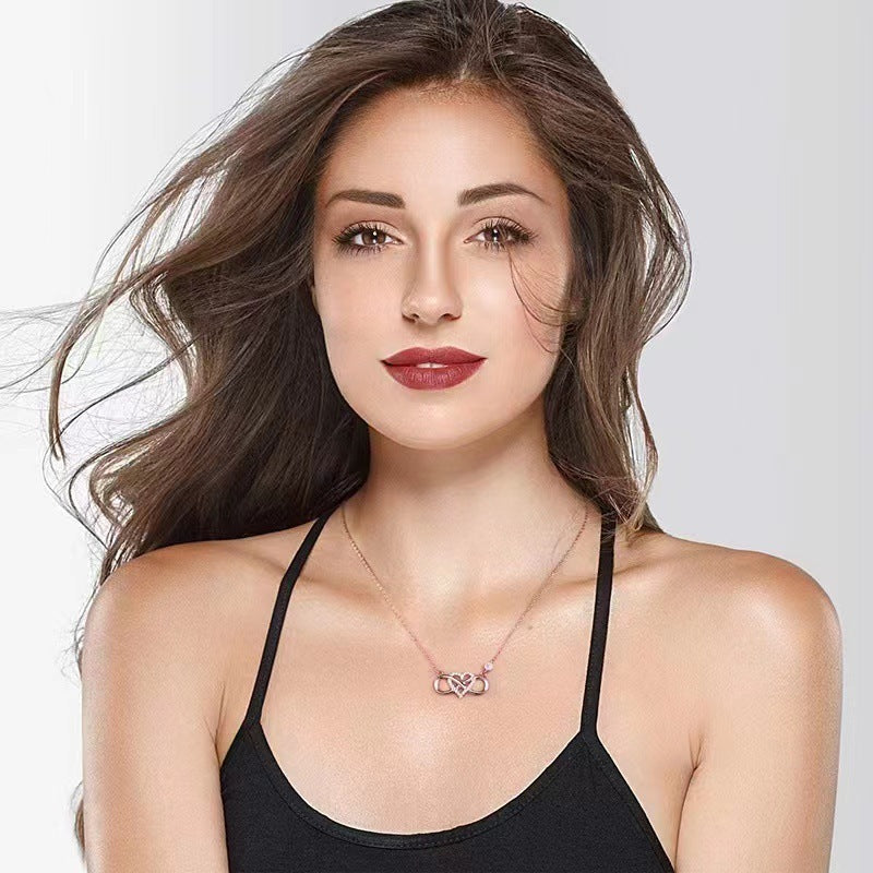 Black dressed girl wearing S925 Sterling Silver Infinite Heart Necklace