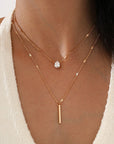 Girl wearing gold colored Small Diamond Long Fringe Pendant Necklace