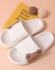 White colored Cute Bear Slippers Summer Beach Shoes beside wool ball