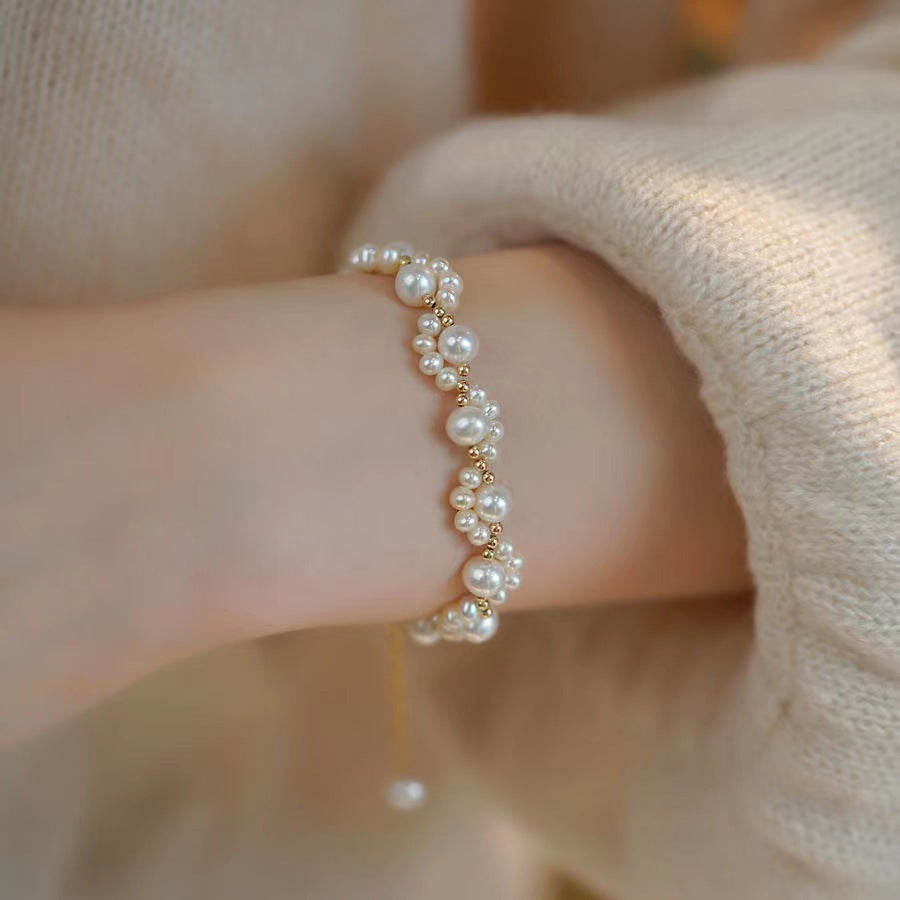 Korean Cat Claw Pearl Bracelet for Women in white dressed woman's hand