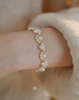 Korean Cat Claw Pearl Bracelet for Women in white dressed woman's hand