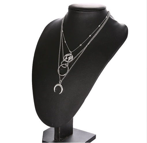 Fashionable Multilayer Moon Map Boho Necklace over a black mannequin 