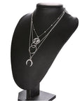 Fashionable Multilayer Moon Map Boho Necklace over a black mannequin 