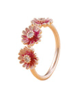 Three pink daisy rings