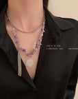 Black dressed woman wearing Korean Purple Stone Necklace