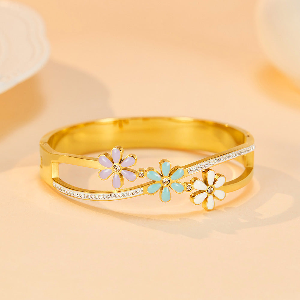 Little Daisy Gold Bracelet in yellow background