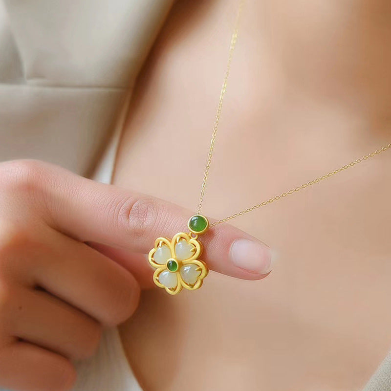 Girl holding Gold Green Clover Necklace