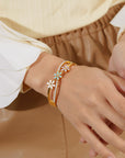 Little Daisy Gold Bracelet in woman's hand