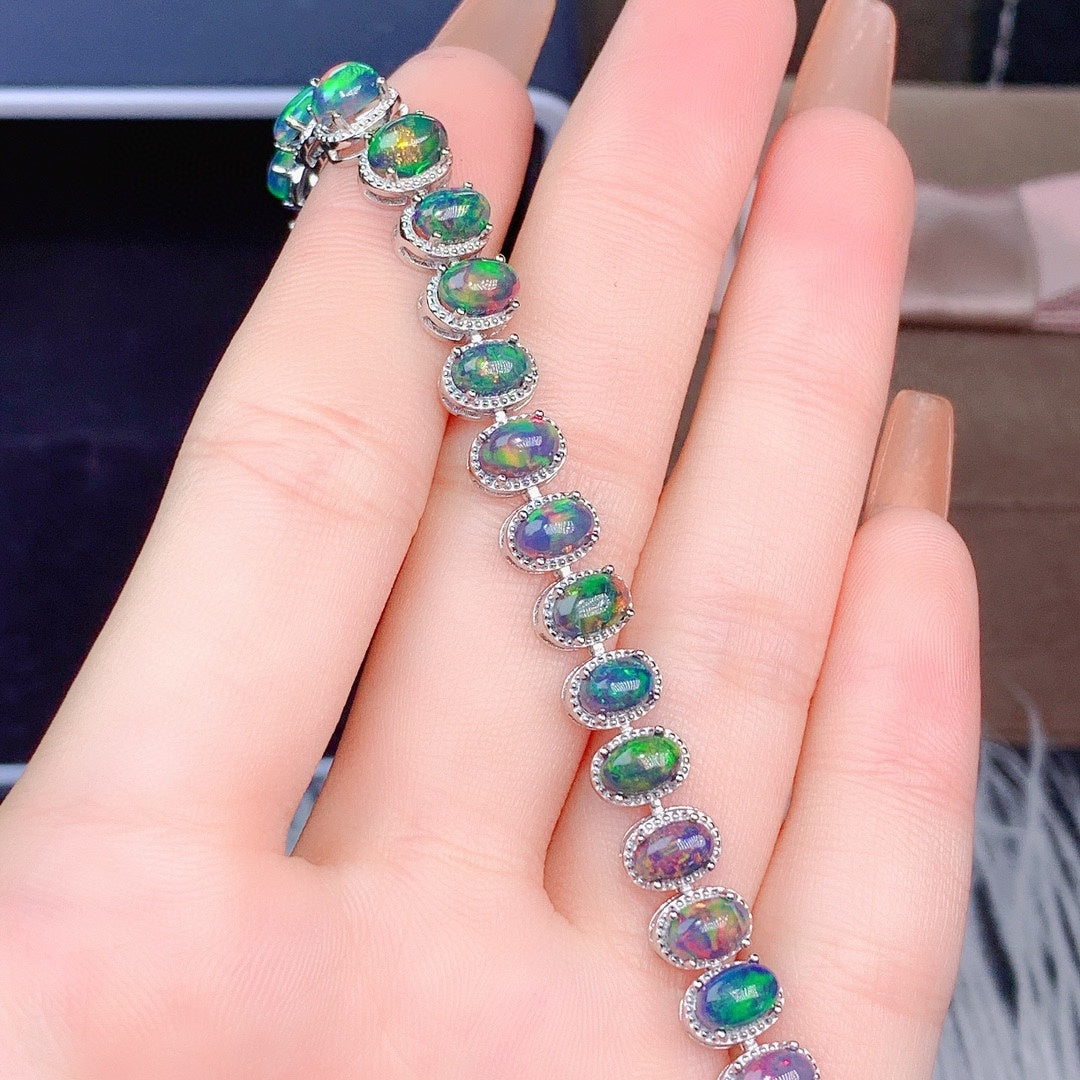 Natural Black Opal Bracelet in beautiful woman's hand