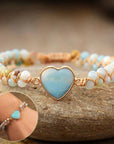 Amazonite String Braided Heart Bracelet over a stone