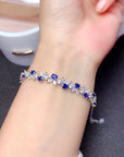 925 Sterling Silver Sapphire Bracelet in woman's hand