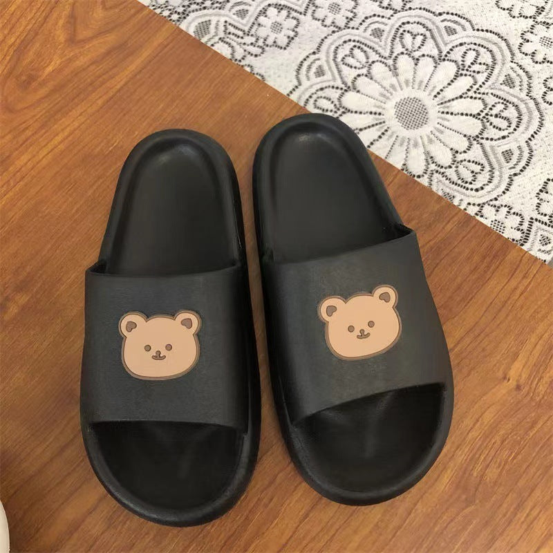 Black colored Cute Bear Slippers Summer Beach Shoes over table