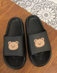 Black colored Cute Bear Slippers Summer Beach Shoes over table