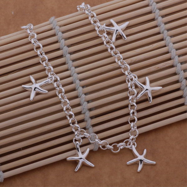 925 Silver Starfish Pendant Bracelet over sticks